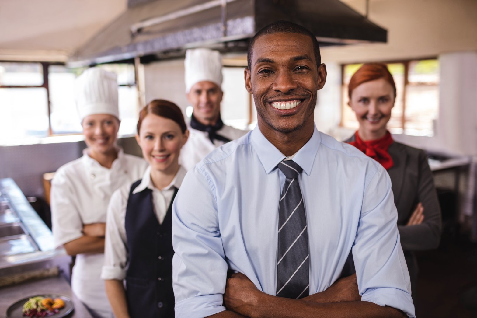 Professional restaurant and hospitality staff standing together
